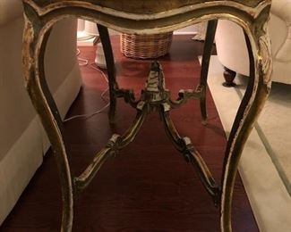 Lot 9186.  $325.00 Italian style wood table with embellished curved legs and a black and cream marble top.  Beautiful and certain to be a real conversation piece.	34" W x 26" D x 32" H