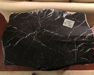 Lot 9186.  $325.00 Italian style wood table with embellished curved legs and a black and cream marble top.  Beautiful and certain to be a real conversation piece.	34" W x 26" D x 32" H