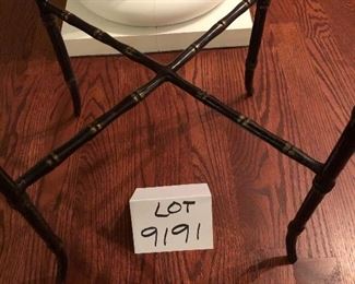 Lot 9191. $125.00 This interesting side table is actually a very heavy, handled tray that sits on a stand that is equally sturdy and attractive.  Note the bamboo leg design.	25.5" W x 15.5" D x 26" H