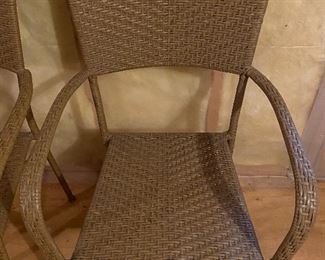 Lot 9193.  $120/set of 4  This set of 4 outdoor wicker chairs is unbranded, but of very good quality.  The outdoor wicker is tightly woven, shows no signs of wear and presents beautifully in a muted shade of taupe.	each chair: 22" W x 21" D x 35" H at the back