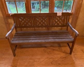 Lot 9194.  $285.00 Great for your patio, porch or yard, this teak bench by FSC is sturdy and in great condition.  The armed bench has triple panels in a cross hatch design on the back that gives it a nostalgic, yet contemporary vibe. 	58"W x 25" D x 34" H
