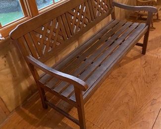 Lot 9194.  $285.00 Great for your patio, porch or yard, this teak bench by FSC is sturdy and in great condition.  The armed bench has triple panels in a cross hatch design on the back that gives it a nostalgic, yet contemporary vibe. 	58"W x 25" D x 34" H