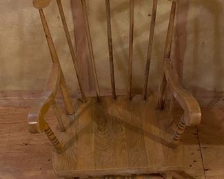 Lot 9195. $38.00 Vintage child's rocker in a natural finish.  This rocker has wear on the finish that can be easily re-finished.  Sturdy ane in otherwise great condition.	18"W x 22"D x 28"H