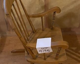 Lot 9195. $38.00 Vintage child's rocker in a natural finish.  This rocker has wear on the finish that can be easily re-finished.  Sturdy ane in otherwise great condition.	18"W x 22"D x 28"H