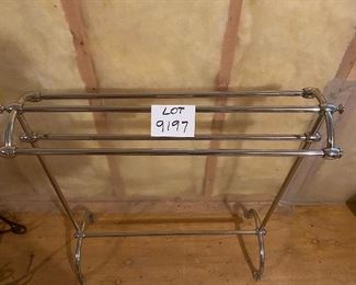 Lot 9197.  $35.00 This towel or blanket rack has a polished brass finish over metal.  In good shape.	32"W x 12"D x 34"H