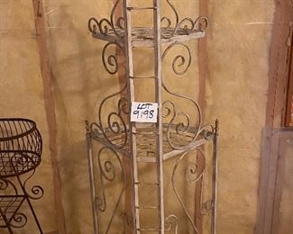 Lot 9198. $50.00. Up for sale is an attractive, heavy metal, corner triple shelf.  It has a white finish with brass trim and accents.  Great storage for a small space.	25"W x 64" T x 16"D.  Plants look terrific on these corner shelve as well.