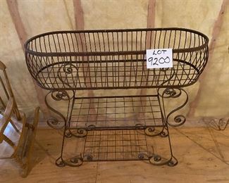 Lot 9200.  $95.00 Metal outdoor planter with 2 lower shelves.  This is a functional planter that looks great outdoors or in a sunroom.  	34"W x 12"D x 33.5"H