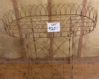 Lot 9201. $135.00 Another plant stand, but this is a vintage gem.  The large top tray can accommodate multiple potted plants and the spacious lower shelf can do double duty with more plants or garden accessories.  Might also be cute as a bar stand in a sunroom or patio.  Cute, nostalgic and in great shape.	21"W x 36"L x 34"T