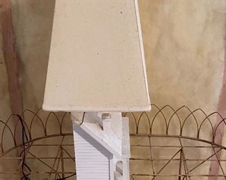 Lot 9202. $145.00 This lamp with a house base is doubly functional since the rooftop lifts and has storage for remotes!	26.5" T on a 13" x 6" base. Shade is 19" x 9"