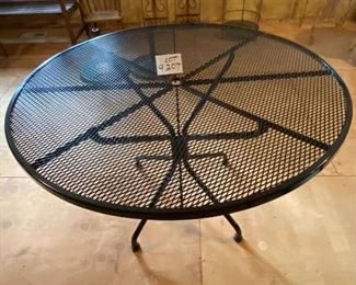 Lot 9207.  $300.00 Woodard black mesh top table for outdoor or indoor use.  This table still sparkles like the day it was purchased, clean, sturdy and carefully maintained.  Woodard is a premier outdoor furniture manufacturer.  It's made to last.	48"D x 29"T