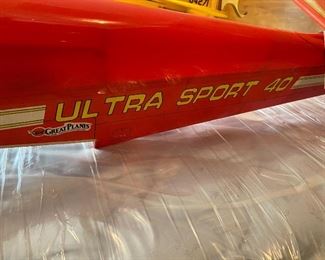 Lot 9212.  $80.00 Great Plains Radio Control Airplane - Ultra Sport 40. Red, needs wings., for parts only. 48"L x 22" Wx 11" T