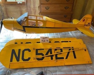  Lot 9214. $150.00  Piper Cub Radio Control Airplane, in a vibrant yellow color.  All decals in place and in good condition, all parts are with this plane. NC54271.  No Remote control	48" L x 77" W wingspan