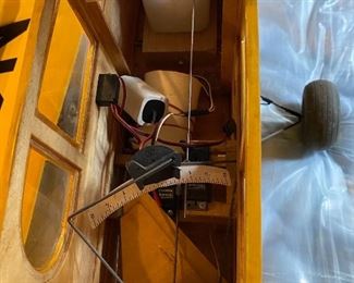 Lot 9214. $150.00  Piper Cub Radio Control Airplane, in a vibrant yellow color.  All decals in place and in good condition, all parts are with this plane. NC54271.  No Remote control	48" L x 77" W wingspan