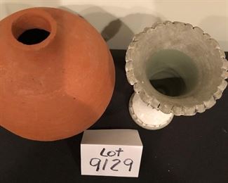 Lot 9129.  $28.00 Lot of two unique vases: a terra cotta vase with wide body and narrow neck and a glazed pottery vase on a square base.	terra cotta vase: 10" T x 7"W and pottery vase 7.5"T  x 5.5"