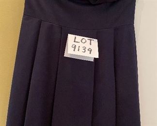 Lot 9139. $68.00. Trina Turk Los Angeles Strapless Navy dress, empire waist line, with quasi-petals that cover the bosom.  From the top of the side underarm to the bottom, measures 29', WAIST measures 15" x2, Has rubberized or silicone reinforced at the top in the seam so it will hold up the top.  Trina Turk's dresses typically go between $250-$350 or more at Neiman Marcus, Saks, etc.  This dress is a super deal!