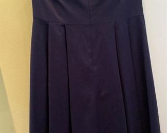 Lot 9139. $68.00. Trina Turk Los Angeles Strapless Navy dress, empire waist line, with quasi-petals that cover the bosom.  From the top of the side underarm to the bottom, measures 29', WAIST measures 15" x2, Has rubberized or silicone reinforced at the top in the seam so it will hold up the top.  Trina Turk's dresses typically go between $250-$350 or more at Neiman Marcus, Saks, etc.  This dress is a super deal!