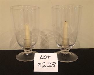Lot 9223.  $50.00.  A pair of glass hurricane lamps 11" H x 6" W.