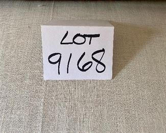 Lot 9168.  $295.00 Upholstered settee with cream colored fabric and green wood finish with gold accent trim.  The upholstered back needs to be secured to the settee. The settee matches the chair from previous lot #9167	42" W x 39" H x 24" D