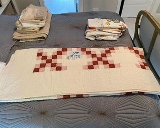 Lot 9175.  $65.00 Vintage rose colored, solid and floral print, hand stitched quilt.	90" L x 80" W