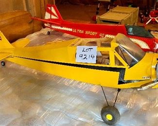 Lot 9214. $150.00  Piper Cub Radio Control Airplane, in a vibrant yellow color.  All decals in place and in good condition, all parts are with this plane. NC54271.  No Remote control	48" L x 77" W wingspan