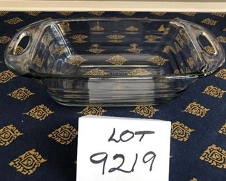Lot 9219. $50.00.  Another cooking lot, a Rosle Passetout stainless steel food mill and a Fire King clear glass loaf pan with handles.