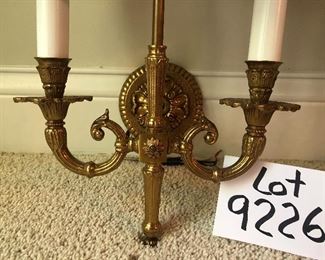 Lot 9226.  $400.00. Two brass Bouillotte wall sconce/lights with black metal oval shades.  They measure 17" Tx14" W x 9"D and were made in Spain.