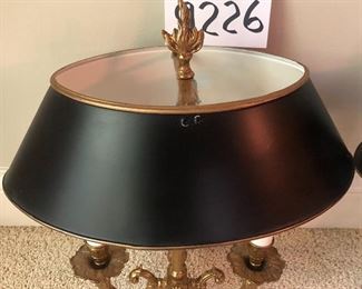 Lot 9226.  $400.00. Two brass Bouillotte wall sconce/lights with black metal oval shades.  They measure 17" Tx14" W x 9"D and were made in Spain.