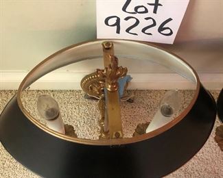 Lot 9226.  $400.00. Two brass Bouillotte wall sconce/lights with black metal oval shades.  They measure 17" Tx14" W x 9"D and were made in Spain.