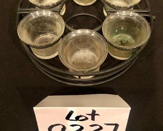 Lot 9227.  $50.00.  Patio table candle set that circles the umbrella pot and a 2 tiered handled basket. (15" W x 10"D x 20).  