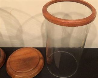 Lot 9229.  $60.00/pr.    Two Williams -Sonoma wood and glass hurricane candle holder. 12" H x 6.5" W.
