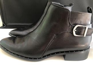 Lot 9148  $55.00. Steve Madden Super Nice Black Leather ankle boots, ladies size 9, purchased at Anthropologie for $128.00, sale price and still have sticker on the bottom - appear to only have been worn once, in excellent used condition.  The shoes have very slight silver studs around the base of the boot - looks classy, with a buckle on either side next to the zipper. 