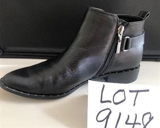 Lot 9148  $55.00. Steve Madden Super Nice Black Leather ankle boots, ladies size 9, purchased at Anthropologie for $128.00, sale price and still have sticker on the bottom - appear to only have been worn once, in excellent used condition.  The shoes have very slight silver studs around the base of the boot - looks classy, with a buckle on either side next to the zipper. 