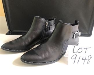 Lot 9148  $55.00. Steve Madden Super Nice Black Leather ankle boots, ladies size 9, purchased at Anthropologie for $128.00, sale price and still have sticker on the bottom - appear to only have been worn once, in excellent used condition.  The shoes have very slight silver studs around the base of the boot - looks classy, with a buckle on either side next to the zipper. 