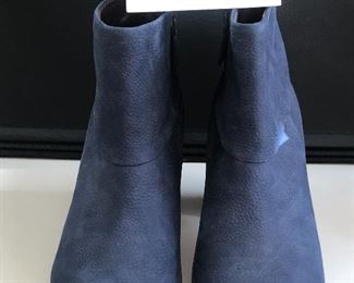 Lot 9152. $45.00. Cole Haan just terrific Ankle Boots with Nike Air Cushioning, in Blue Leather with zipper on the inside of the boot.  These booots do not look worn and considering Cole Haan and Nike parted ways a way back, this is like buying a brand new pair of boots with the best of both the Cole Haan and Nike worlds.  These boots are make for walking....comfortably.  Look great with jeans.