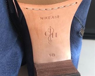 Lot 9152. $45.00. Cole Haan just terrific Ankle Boots with Nike Air Cushioning, in Blue Leather with zipper on the inside of the boot.  These booots do not look worn and considering Cole Haan and Nike parted ways a way back, this is like buying a brand new pair of boots with the best of both the Cole Haan and Nike worlds.  These boots are make for walking....comfortably.  Look great with jeans.