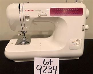 Lot 9234.  $75.00.  Singer portable sewing machine - Protege Model 2639.  In box.