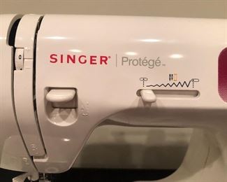Lot 9234.  $75.00.  Singer portable sewing machine - Protege Model 2639.  In box.