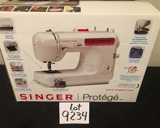 Lot 9234.  $75.00.  Singer portable sewing machine - Protege Model 2639.  In box.