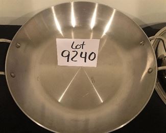 Lot 9240.   $165.00.  All Clad two-handled saute pan or perhaps a wok  (13" Dia x 3"T) with lid and All Clad slotted spoon.