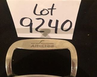 Lot 9240.   $165.00.  All Clad two-handled saute pan or perhaps a wok  (13" Dia x 3"T) with lid and All Clad slotted spoon.