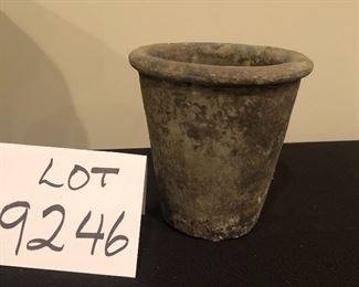 Lot 9246.  $40.00.  2 Concrete flower pots with one with seashells (9"H x 10"W) and one plain(5"H x 5"W)		$40.00	