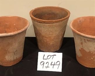 Lot 9249. $30.00.   Three terra cotta hand made pots.