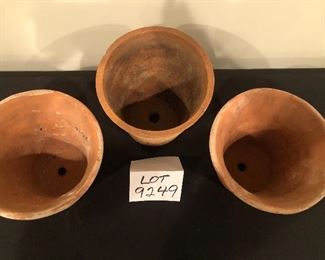 Lot 9249. $30.00.   Three terra cotta hand made pots.