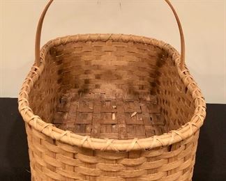 Lot 9259.  $42.00.  Handled basket (16"L x 9.5" W x 6"H) and a handled basket (27"L x 17"W x 10"H).  A terrific picnic basket, flower or vegetable gathering basket from the garden, catch-all basket for the stairs, and a hundred other uses - plus it's very attractive!