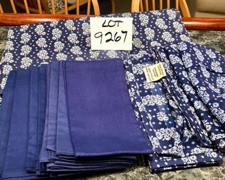 Lot 9267.   $75.00.  Pottery Barn blue print 100% cotton tablecloth (70" x 90"), 8 matching napkins and 8 coordinating, solid navy napkins from Williams Sonoma.
