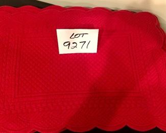 Lot 9271.  $39.00.  8 red, quilted placemats and a red, silk table runner.