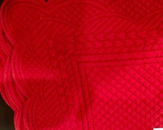 Lot 9271.  $39.00.  8 red, quilted placemats and a red, silk table runner.
