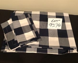 Lot 9274.  $30.00.  From Williams Sonoma, a black and white checked table cloth and 3 matching napkins.  Table cloth is 70" x 108".