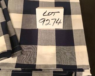 Lot 9274.  $30.00.  From Williams Sonoma, a black and white checked table cloth and 3 matching napkins.  Table cloth is 70" x 108".