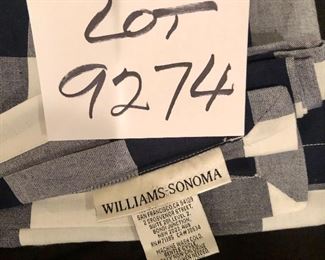 Lot 9274.  $30.00.  From Williams Sonoma, a black and white checked table cloth and 3 matching napkins.  Table cloth is 70" x 108".